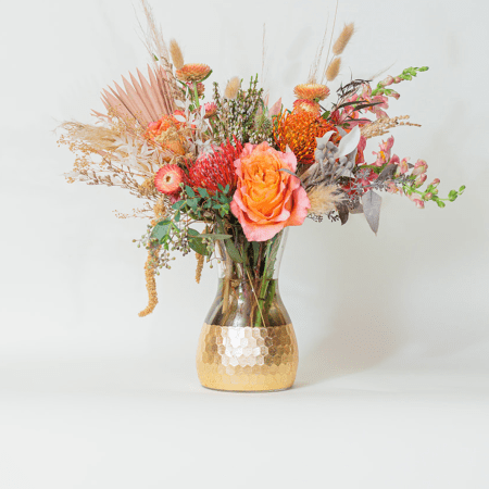 Embrace the warm, earthy elegance of our Boho Bliss arrangement, designed for those who love free-spirited beauty.