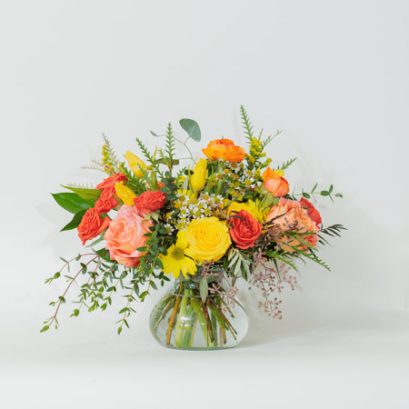 Vibrant, sunny, and full of warmth, this stunning arrangement bursts with rich oranges and cheerful yellows!