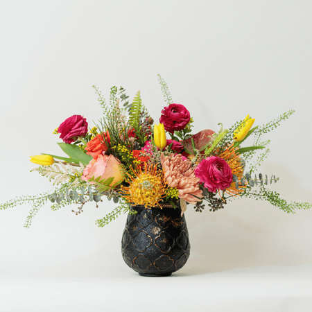 Vibrant, bold, and full of energy, this stunning arrangement is a celebration of color and contrast!