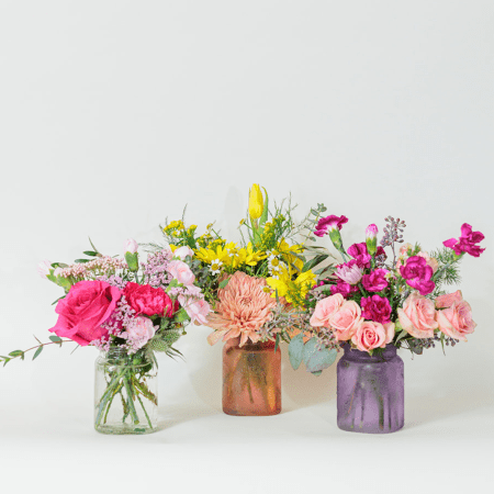 Charming and versatile, this Mini Bundle Collection features 3 beautiful mini vases, each filled with a unique mix of vibrant blooms in different colors.