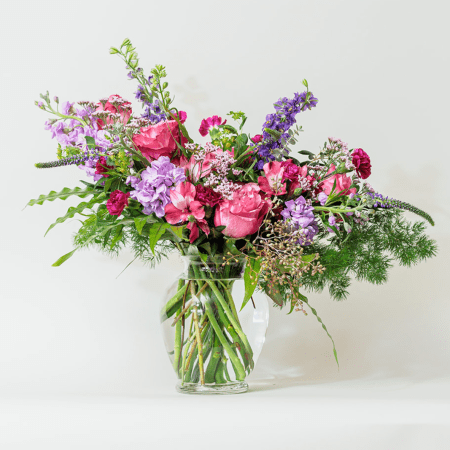 Soft yet striking, this beautiful arrangement combines soothing lavender hues with rich purples for a truly enchanting display.