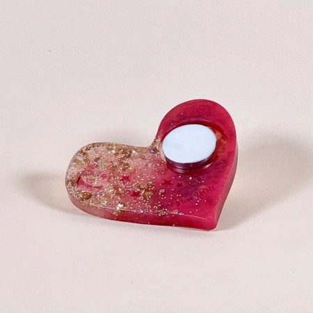 Light up your space with love and warmth with this heart-shaped tealight candle holder, handcrafted by a skilled local artisan using high-quality resin.