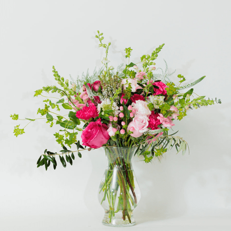 Bold, beautiful, and full of charm, this stunning arrangement features a captivating mix of hot pinks, blush tones, and delicate textures.